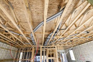 Duct runs in open web truss