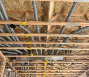 Duct runs in open web trusses