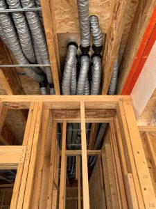 Duct routing to a down flow manifold