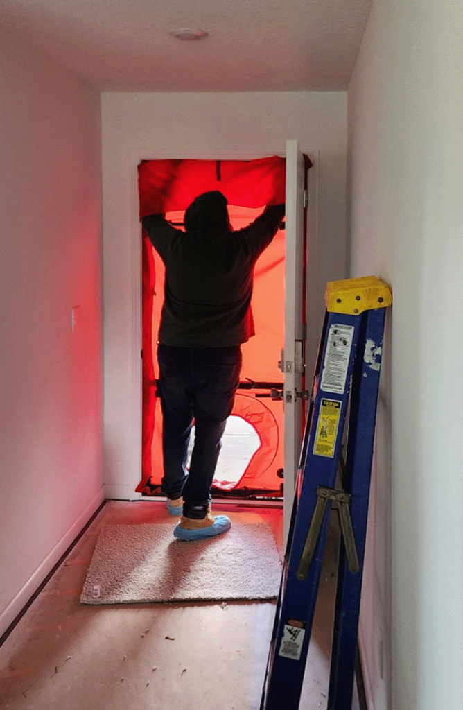 Energy rating a home using a blower door test