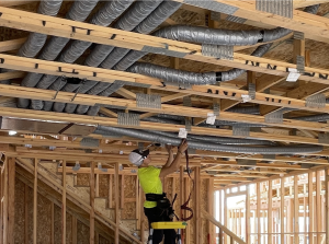 Installer strapping duct in place